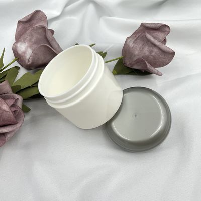 Bộ mỹ phẩm du lịch bằng nhựa tròn lọ đựng 50g Dập nóng với hoa văn khác nhau