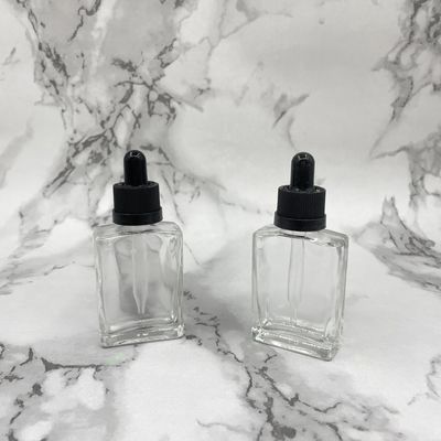 Hình vuông 30ml Chai mỹ phẩm thủy tinh nhỏ giọt Nắp chống trẻ em cho dầu chăm sóc tóc