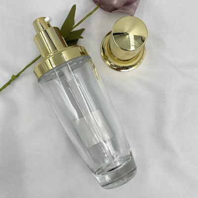 Chai mỹ phẩm hình bầu dục trong suốt 100ml Kem dưỡng da nắp vàng Màu tùy chỉnh